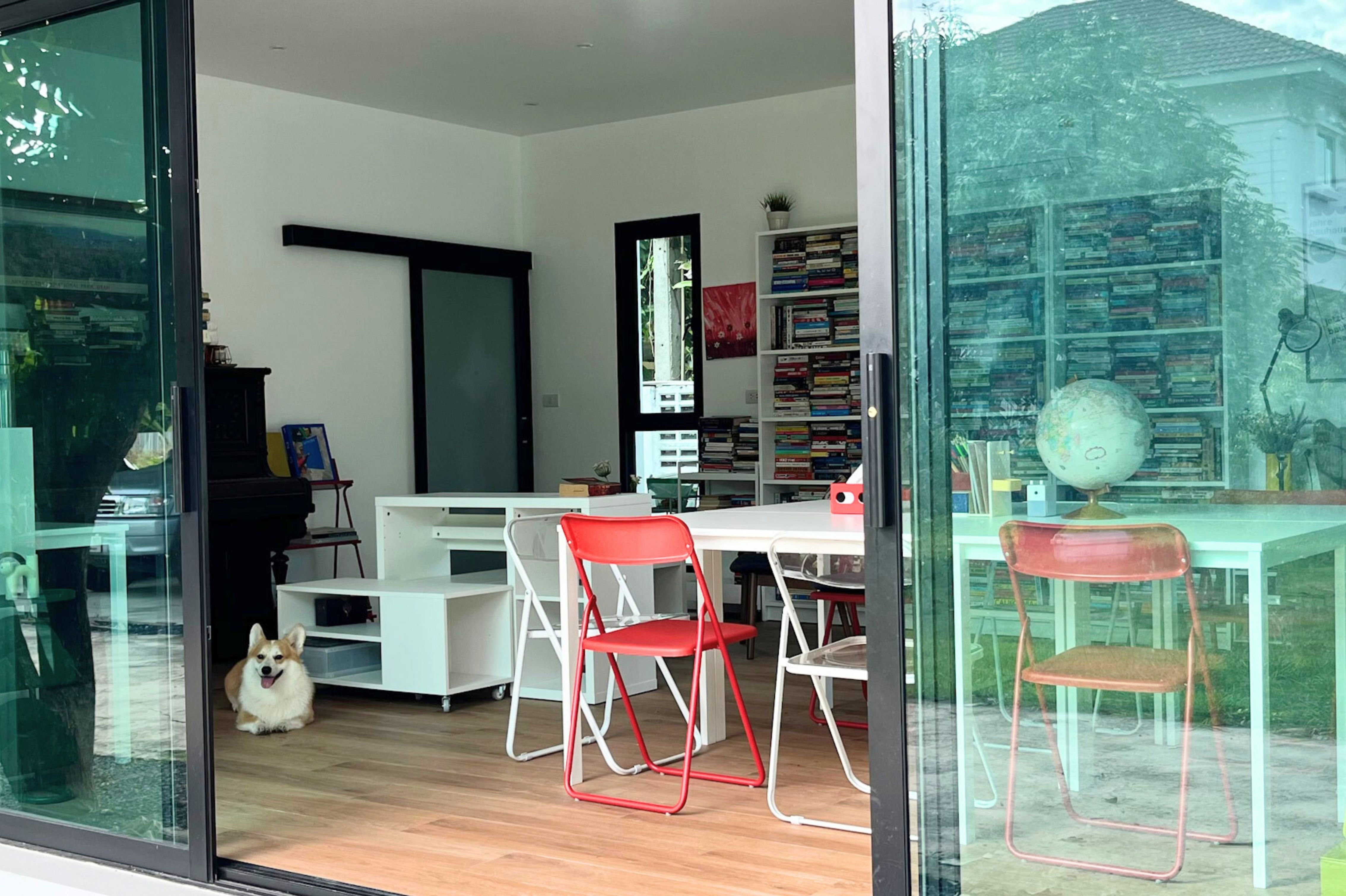 A photo of coffee next to a stack of books
